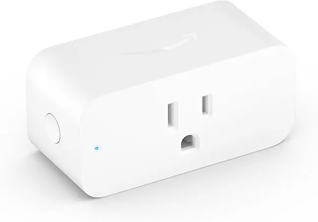 A white box with an outlet on top of it.