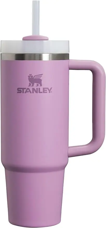 A purple mug with the word stanley on it.