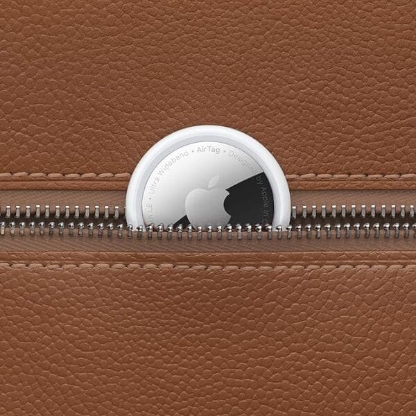 A close up of an open brown leather wallet