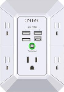 A white outlet with four outlets and two usb ports.