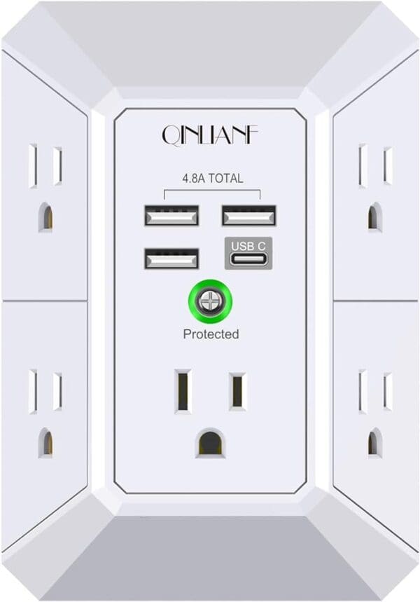 A white outlet with four outlets and two usb ports.