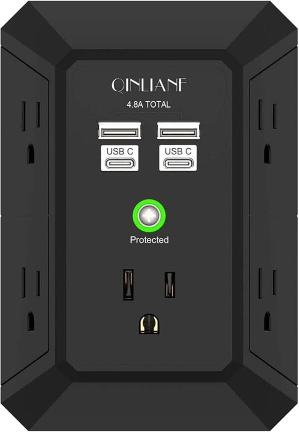 A black wall outlet with four usb ports.