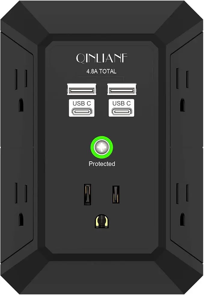 A black wall outlet with four usb ports.