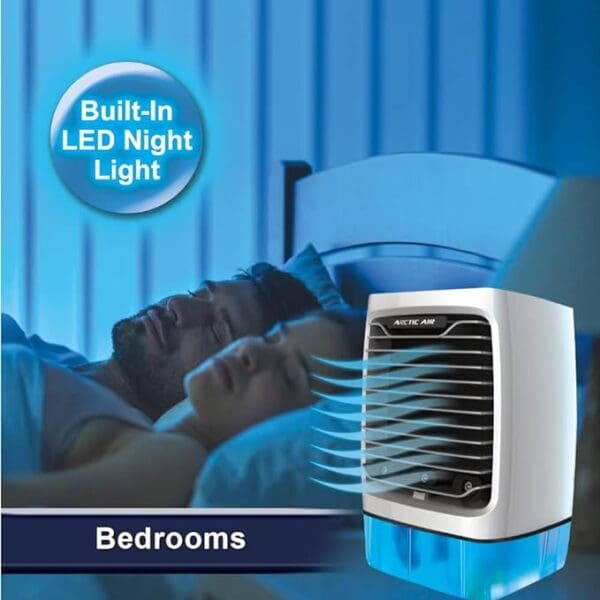 A blue and white air conditioner sitting on top of a bed.